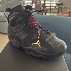Black Air Jordan Sneakers with Gold Accent